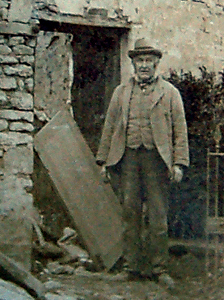 Thomas Wooding standing outside the gutted Royal Oak in 1902 [AD1082/3]